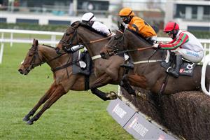 NEWBURY, ENGLAND - DECEMBER 29: A general view of tight action over a fence during The MansionBet's Bet 10 Get 20 Novices' Limited Handicap Chase at Newbury Racecourse on December 29, 2020 in Newbury, England. Owners are allowed to attend if they have a runner at the meeting otherwise racing remains behind closed doors to the public due to the Coronavirus pandemic. (Photo by Alan Crowhurst/Getty Images)