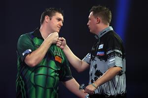 LONDON, ENGLAND - DECEMBER 29: Daryl Gurney of Northern Ireland (L) and Chris Dobey of England congratulate each other after there third round match against during day twelve of the PDC William Hill World Darts Championship at Alexandra Palace on December 29, 2020 in London, England. (Photo by Luke Walker/Getty Images)