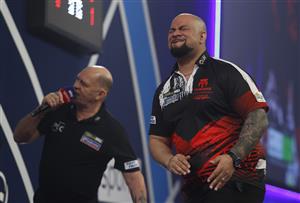 LONDON, ENGLAND - DECEMBER 29: Devon Petersen of South Africa reacts during his third round match against Jason Lowe of England during day twelve of the PDC William Hill World Darts Championship at Alexandra Palace on December 29, 2020 in London, England. (Photo by Luke Walker/Getty Images)
