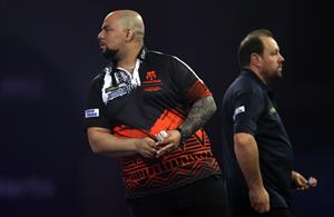 LONDON, ENGLAND - DECEMBER 29: Devon Petersen of South Africa in action during his third round match against Jason Lowe of England during day twelve of the PDC William Hill World Darts Championship at Alexandra Palace on December 29, 2020 in London, England. (Photo by Luke Walker/Getty Images)