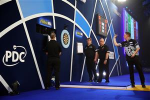 LONDON, ENGLAND - DECEMBER 29: Chris Dobey of England in action during his third round match against Daryl Gurney of Northern Ireland during day twelve of the PDC William Hill World Darts Championship at Alexandra Palace on December 29, 2020 in London, England. (Photo by Luke Walker/Getty Images)