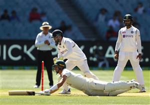 MELBOURNE, AUSTRALIA - DECEMBER 29: Rishabh Pant of India attempts to run out Pat Cummins of Australia during day four of the Second Test match between Australia and India at Melbourne Cricket Ground on December 29, 2020 in Melbourne, Australia. (Photo by Robert Cianflone/Getty Images)