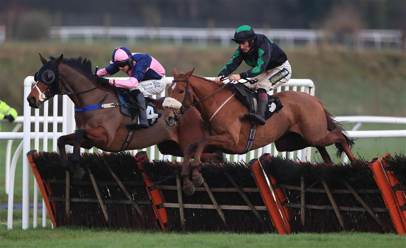 MARKET RASEN, ENGLAND - DECEMBER 30: Golden Emblem ridden by Sam Twiston-Davies (right) jumps the last to win the Follow RacingTV On Twitter Novices' Handicap Hurdle at Market Rasen Racecourse on December 30, 2020 in Market Rasen, England. (Photo by Mike Egerton - Pool/Getty Images)
