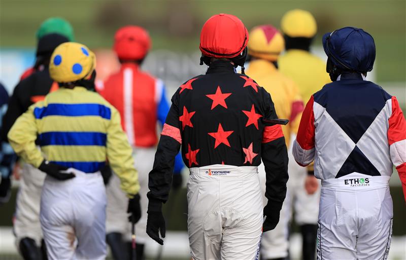 MARKET RASEN, ENGLAND - DECEMBER 30: Jockeys walk to the parade ring at Market Rasen Racecourse on December 30, 2020 in Market Rasen, England. (Photo by Mike Egerton - Pool/Getty Images)