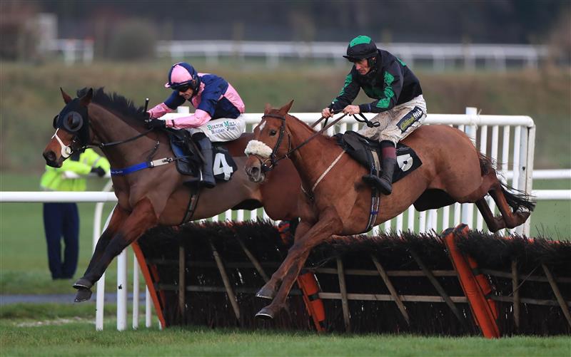 MARKET RASEN, ENGLAND - DECEMBER 30: Golden Emblem ridden by Sam Twiston-Davies (right) jumps the last to win the Follow RacingTV On Twitter Novices' Handicap Hurdle at Market Rasen Racecourse on December 30, 2020 in Market Rasen, England. (Photo by Mike Egerton - Pool/Getty Images)