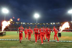 GOLD COAST, AUSTRALIA - DECEMBER 29: Renegades run onto the field during the Big Bash League match between the Melbourne Renegades and the Sydney Sixers at Metricon Stadium, on December 29, 2020, in Gold Coast, Australia. (Photo by Chris Hyde/Getty Images)