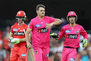 GOLD COAST, AUSTRALIA - DECEMBER 29: Ben Manenti of the Sixers celebrates after dismissing Sam Harper of the Renegades during the Big Bash League match between the Melbourne Renegades and the Sydney Sixers at Metricon Stadium, on December 29, 2020, in Gold Coast, Australia. (Photo by Chris Hyde/Getty Images)