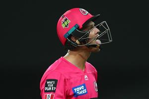 GOLD COAST, AUSTRALIA - DECEMBER 29: Josh Philippe of the Sixers leaves the field after being dismissed during the Big Bash League match between the Melbourne Renegades and the Sydney Sixers at Metricon Stadium, on December 29, 2020, in Gold Coast, Australia. (Photo by Chris Hyde/Getty Images)