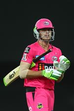 GOLD COAST, AUSTRALIA - DECEMBER 29: Daniel Hughes of the Sixers leaves the field after being dismissed during the Big Bash League match between the Melbourne Renegades and the Sydney Sixers at Metricon Stadium, on December 29, 2020, in Gold Coast, Australia. (Photo by Chris Hyde/Getty Images)