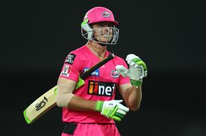 GOLD COAST, AUSTRALIA - DECEMBER 29: Daniel Hughes of the Sixers leaves the field after being dismissed during the Big Bash League match between the Melbourne Renegades and the Sydney Sixers at Metricon Stadium, on December 29, 2020, in Gold Coast, Australia. (Photo by Chris Hyde/Getty Images)