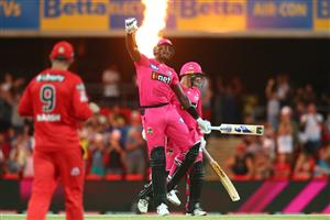 GOLD COAST, AUSTRALIA - DECEMBER 29: Jason Holder and Ben Manenti of the Sixers celebrate winning the Big Bash League match between the Melbourne Renegades and the Sydney Sixers at Metricon Stadium, on December 29, 2020, in Gold Coast, Australia. (Photo by Chris Hyde/Getty Images)