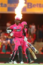 GOLD COAST, AUSTRALIA - DECEMBER 29: Jason Holder and Ben Manenti of the Sixers celebrate winning the Big Bash League match between the Melbourne Renegades and the Sydney Sixers at Metricon Stadium, on December 29, 2020, in Gold Coast, Australia. (Photo by Chris Hyde/Getty Images)