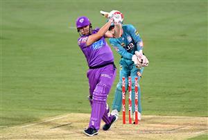 BRISBANE, AUSTRALIA - DECEMBER 30: Scott Bolland of the Hurricanes is bowled out by Mujeeb Ur Rahman of the Heat during the Big Bash League match between the Hobart Hurricanes and Brisbane Heat at The Gabba, on December 30, 2020, in Brisbane, Australia. (Photo by Bradley Kanaris/Getty Images)