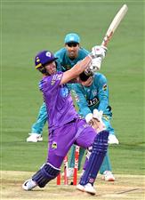 BRISBANE, AUSTRALIA - DECEMBER 30: Ben McDermott of the Hurricanes is bowled out by Mujeeb Ur Rahman of the Heat during the Big Bash League match between the Hobart Hurricanes and Brisbane Heat at The Gabba, on December 30, 2020, in Brisbane, Australia. (Photo by Bradley Kanaris/Getty Images)