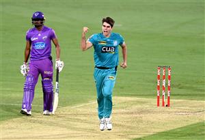 BRISBANE, AUSTRALIA - DECEMBER 30: Xavier Bartlett of the Heat celebrates taking the wicket of Tim David of the Hurricanes during the Big Bash League match between the Hobart Hurricanes and Brisbane Heat at The Gabba, on December 30, 2020, in Brisbane, Australia. (Photo by Bradley Kanaris/Getty Images)