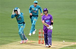 BRISBANE, AUSTRALIA - DECEMBER 30: Ben McDermott of the Hurricanes is bowled out by Mujeeb Ur Rahman of the Heat during the Big Bash League match between the Hobart Hurricanes and Brisbane Heat at The Gabba, on December 30, 2020, in Brisbane, Australia. (Photo by Bradley Kanaris/Getty Images)