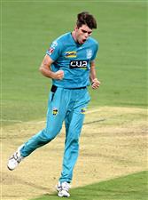 BRISBANE, AUSTRALIA - DECEMBER 30: Xavier Bartlett of the Heat celebrates taking the wicket of Tim David of the Hurricanes during the Big Bash League match between the Hobart Hurricanes and Brisbane Heat at The Gabba, on December 30, 2020, in Brisbane, Australia. (Photo by Bradley Kanaris/Getty Images)