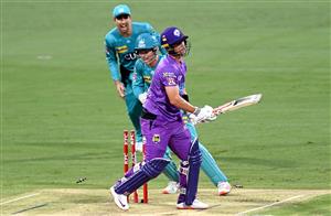 BRISBANE, AUSTRALIA - DECEMBER 30: Ben McDermott of the Hurricanes is bowled out by Mujeeb Ur Rahman of the Heat during the Big Bash League match between the Hobart Hurricanes and Brisbane Heat at The Gabba, on December 30, 2020, in Brisbane, Australia. (Photo by Bradley Kanaris/Getty Images)