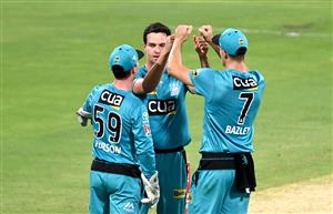 BRISBANE, AUSTRALIA - DECEMBER 30: Jack Wildermuth of the Heat celebrates taking the wicket of Pete Handscomb of the Hurricanes during the Big Bash League match between the Hobart Hurricanes and Brisbane Heat at The Gabba, on December 30, 2020, in Brisbane, Australia. (Photo by Bradley Kanaris/Getty Images)