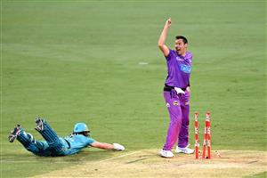 BRISBANE, AUSTRALIA - DECEMBER 30: Scott Bolland of the Hurricanes celebrates victory as Mark Steketee of the Heat is run out on the last bowl of the match during the Big Bash League match between the Hobart Hurricanes and Brisbane Heat at The Gabba, on December 30, 2020, in Brisbane, Australia. (Photo by Bradley Kanaris/Getty Images)