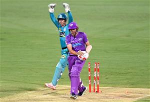 BRISBANE, AUSTRALIA - DECEMBER 30: Scott Bolland of the Hurricanes is bowled out by Mujeeb Ur Rahman of the Heat during the Big Bash League match between the Hobart Hurricanes and Brisbane Heat at The Gabba, on December 30, 2020, in Brisbane, Australia. (Photo by Bradley Kanaris/Getty Images)