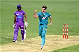 BRISBANE, AUSTRALIA - DECEMBER 30: Xavier Bartlett of the Heat celebrates taking the wicket of Tim David of the Hurricanes during the Big Bash League match between the Hobart Hurricanes and Brisbane Heat at The Gabba, on December 30, 2020, in Brisbane, Australia. (Photo by Bradley Kanaris/Getty Images)