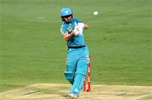 BRISBANE, AUSTRALIA - DECEMBER 30: Lewis Gregory of the Heat hits the ball to the boundary for a four during the Big Bash League match between the Hobart Hurricanes and Brisbane Heat at The Gabba, on December 30, 2020, in Brisbane, Australia. (Photo by Bradley Kanaris/Getty Images)