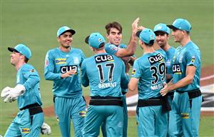 BRISBANE, AUSTRALIA - DECEMBER 30: Xavier Bartlett of the Heat celebrates taking the wicket of Darcy Short of the Hurricanes during the Big Bash League match between the Hobart Hurricanes and Brisbane Heat at The Gabba, on December 30, 2020, in Brisbane, Australia. (Photo by Bradley Kanaris/Getty Images)