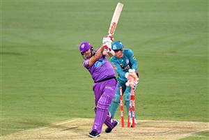 BRISBANE, AUSTRALIA - DECEMBER 30: Scott Bolland of the Hurricanes is bowled out by Mujeeb Ur Rahman of the Heat during the Big Bash League match between the Hobart Hurricanes and Brisbane Heat at The Gabba, on December 30, 2020, in Brisbane, Australia. (Photo by Bradley Kanaris/Getty Images)
