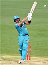 BRISBANE, AUSTRALIA - DECEMBER 30: James Bazley of the Heat hits the ball to the boundary for a four during the Big Bash League match between the Hobart Hurricanes and Brisbane Heat at The Gabba, on December 30, 2020, in Brisbane, Australia. (Photo by Bradley Kanaris/Getty Images)