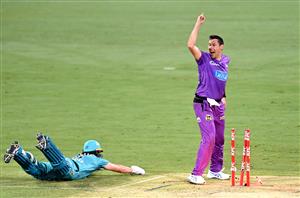 BRISBANE, AUSTRALIA - DECEMBER 30: Scott Bolland of the Hurricanes celebrates victory as Mark Steketee of the Heat is run out on the last bowl of the match during the Big Bash League match between the Hobart Hurricanes and Brisbane Heat at The Gabba, on December 30, 2020, in Brisbane, Australia. (Photo by Bradley Kanaris/Getty Images)