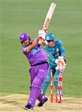 BRISBANE, AUSTRALIA - DECEMBER 30: Scott Bolland of the Hurricanes is bowled out by Mujeeb Ur Rahman of the Heat during the Big Bash League match between the Hobart Hurricanes and Brisbane Heat at The Gabba, on December 30, 2020, in Brisbane, Australia. (Photo by Bradley Kanaris/Getty Images)