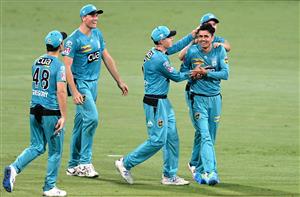 BRISBANE, AUSTRALIA - DECEMBER 30: Mujeeb Ur Rahman of the Heat celebrates taking the wicket of Scott Bolland of the Hurricanes during the Big Bash League match between the Hobart Hurricanes and Brisbane Heat at The Gabba, on December 30, 2020, in Brisbane, Australia. (Photo by Bradley Kanaris/Getty Images)