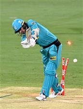 BRISBANE, AUSTRALIA - DECEMBER 30: Tom Cooper of the Heat is bowled out by Riley Meredith of the Hurricanes during the Big Bash League match between the Hobart Hurricanes and Brisbane Heat at The Gabba, on December 30, 2020, in Brisbane, Australia. (Photo by Bradley Kanaris/Getty Images)