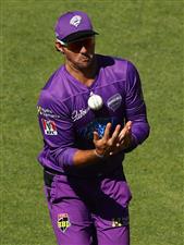 HOBART, AUSTRALIA - JANUARY 04: Tim David of the Hurricanes juggles the ball as he takes a catch to dismiss Nick Larkin of the Melbourne Stars during the Big Bash League match between the Melbourne Stars and the Hobart Hurricanes at Blundstone Arena, on January 04, 2021, in Hobart, Australia. (Photo by Robert Cianflone/Getty Images)