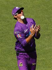 HOBART, AUSTRALIA - JANUARY 04: Tim David of the Hurricanes juggles the ball as he takes a catch to dismiss Nick Larkin of the Melbourne Stars during the Big Bash League match between the Melbourne Stars and the Hobart Hurricanes at Blundstone Arena, on January 04, 2021, in Hobart, Australia. (Photo by Robert Cianflone/Getty Images)