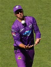 HOBART, AUSTRALIA - JANUARY 04: Tim David of the Hurricanes juggles the ball as he takes a catch to dismiss Nick Larkin of the Melbourne Stars during the Big Bash League match between the Melbourne Stars and the Hobart Hurricanes at Blundstone Arena, on January 04, 2021, in Hobart, Australia. (Photo by Robert Cianflone/Getty Images)