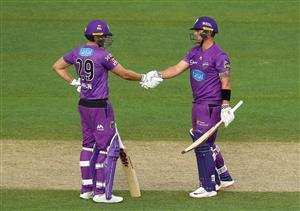 HOBART, AUSTRALIA - JANUARY 04: Ben McDermott of the Hurricanes celebrates after scoring his half century with team mate Dawid Malan during the Big Bash League match between the Melbourne Stars and the Hobart Hurricanes at Blundstone Arena, on January 04, 2021, in Hobart, Australia. (Photo by Robert Cianflone/Getty Images)