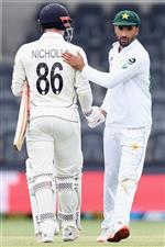 CHRISTCHURCH, NEW ZEALAND - JANUARY 05: Henry Nicholls of New Zealand (L) is greeted by Zafar Gohar of Pakistan after he was dismissed by Mohammad Abbas of Pakistan during day three of the Second Test match in the series between New Zealand and Pakistan at Hagley Oval on January 05, 2021 in Christchurch, New Zealand. (Photo by Kai Schwoerer/Getty Images)