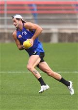 MELBOURNE, AUSTRALIA - JANUARY 06: Josh Bruce runs with the ball during a Western Bulldogs AFL training session at Whitten Oval on January 06, 2021 in Melbourne, Australia. (Photo by Mike Owen/Getty Images)