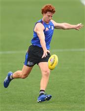 MELBOURNE, AUSTRALIA - JANUARY 06: Ed Richards of the Bulldogs kicks the ball during a Western Bulldogs AFL training session at Whitten Oval on January 06, 2021 in Melbourne, Australia. (Photo by Mike Owen/Getty Images)