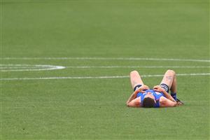 MELBOURNE, AUSTRALIA - JANUARY 06: Tom Liberatore of the Bulldogs recovers on the ground after running during a Western Bulldogs AFL training session at Whitten Oval on January 06, 2021 in Melbourne, Australia. (Photo by Mike Owen/Getty Images)