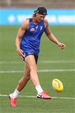 MELBOURNE, AUSTRALIA - JANUARY 06: Aaron Naughton of the bulldogs kicks the ball during a Western Bulldogs AFL training session at Whitten Oval on January 06, 2021 in Melbourne, Australia. (Photo by Mike Owen/Getty Images)