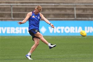 MELBOURNE, AUSTRALIA - JANUARY 06: Adam Treloar of the Bulldogs kicks the ball during a Western Bulldogs AFL training session at Whitten Oval on January 06, 2021 in Melbourne, Australia. (Photo by Mike Owen/Getty Images)
