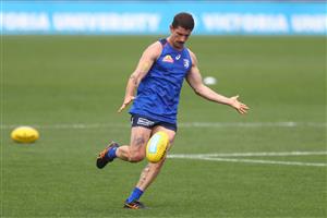 MELBOURNE, AUSTRALIA - JANUARY 06: Tom Liberatore of the Bulldogs kicks the ball during a Western Bulldogs AFL training session at Whitten Oval on January 06, 2021 in Melbourne, Australia. (Photo by Mike Owen/Getty Images)