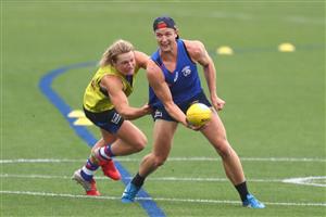 MELBOURNE, AUSTRALIA - JANUARY 06: Will Hayes of the Bulldogs is tackled by Cody Weightman during a Western Bulldogs AFL training session at Whitten Oval on January 06, 2021 in Melbourne, Australia. (Photo by Mike Owen/Getty Images)