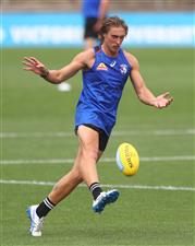 MELBOURNE, AUSTRALIA - JANUARY 06: Roarke Smith of the Bulldogs kicks the ball during a Western Bulldogs AFL training session at Whitten Oval on January 06, 2021 in Melbourne, Australia. (Photo by Mike Owen/Getty Images)