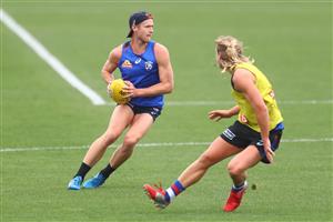 MELBOURNE, AUSTRALIA - JANUARY 06: Will Hayes of the Bulldogs kicks the ball during a Western Bulldogs AFL training session at Whitten Oval on January 06, 2021 in Melbourne, Australia. (Photo by Mike Owen/Getty Images)