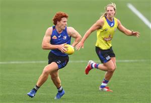 MELBOURNE, AUSTRALIA - JANUARY 06: Ed Richards of the Bulldogs runs with the ball during a Western Bulldogs AFL training session at Whitten Oval on January 06, 2021 in Melbourne, Australia. (Photo by Mike Owen/Getty Images)