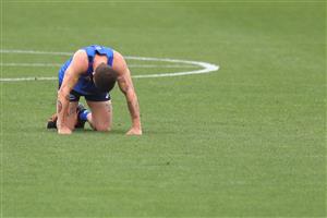 MELBOURNE, AUSTRALIA - JANUARY 06: Tom Liberatore of the Bulldogs recovers on the ground after running during a Western Bulldogs AFL training session at Whitten Oval on January 06, 2021 in Melbourne, Australia. (Photo by Mike Owen/Getty Images)